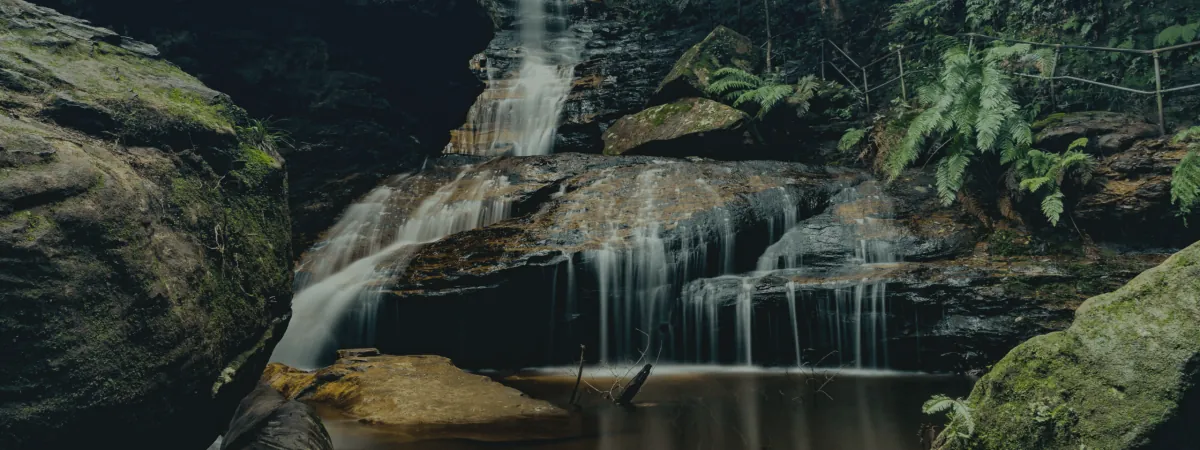 A waterfall over mossy rocks